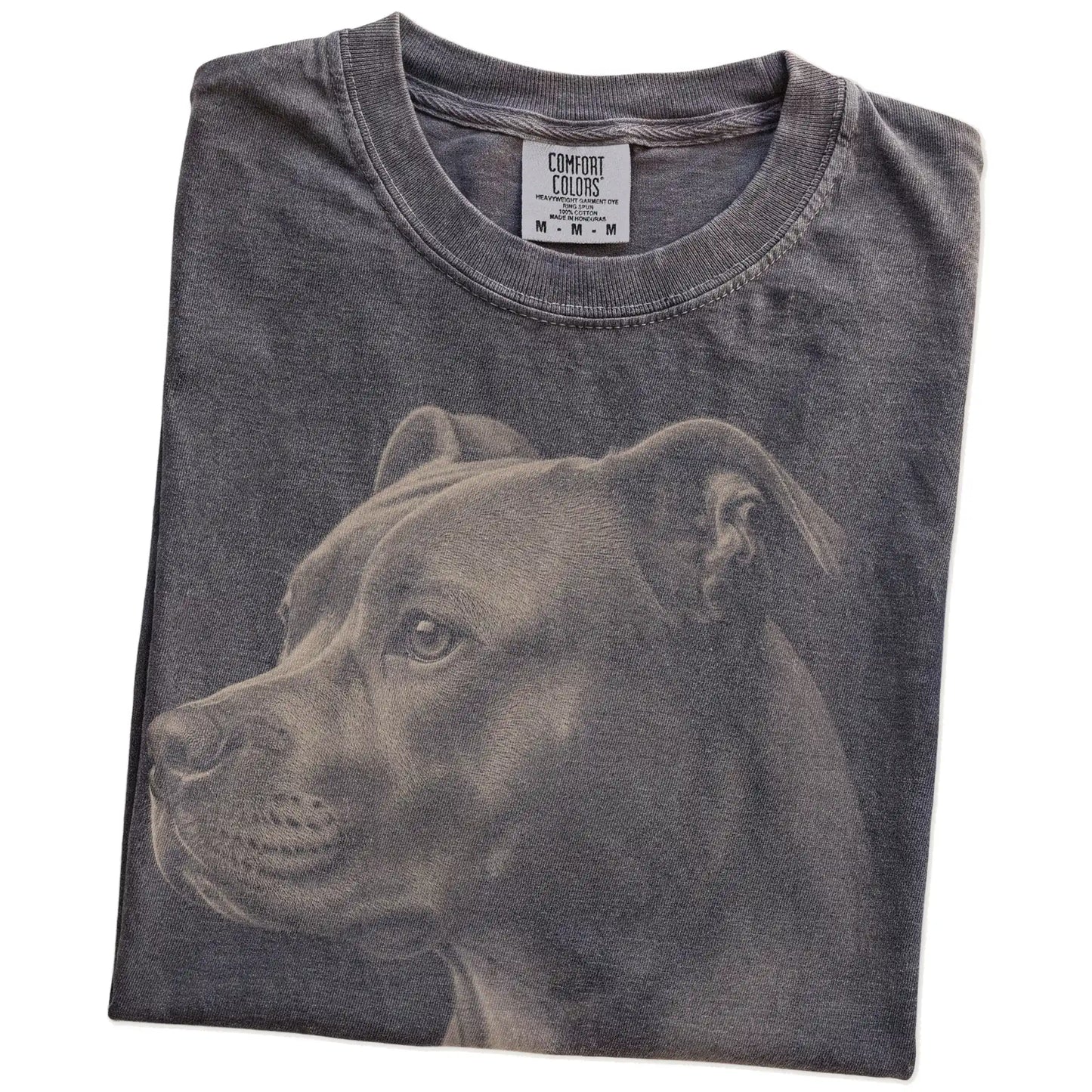 Folded Pepper Comfort Colors® T-shirt showing a detailed photographic portrait of a Pitbull