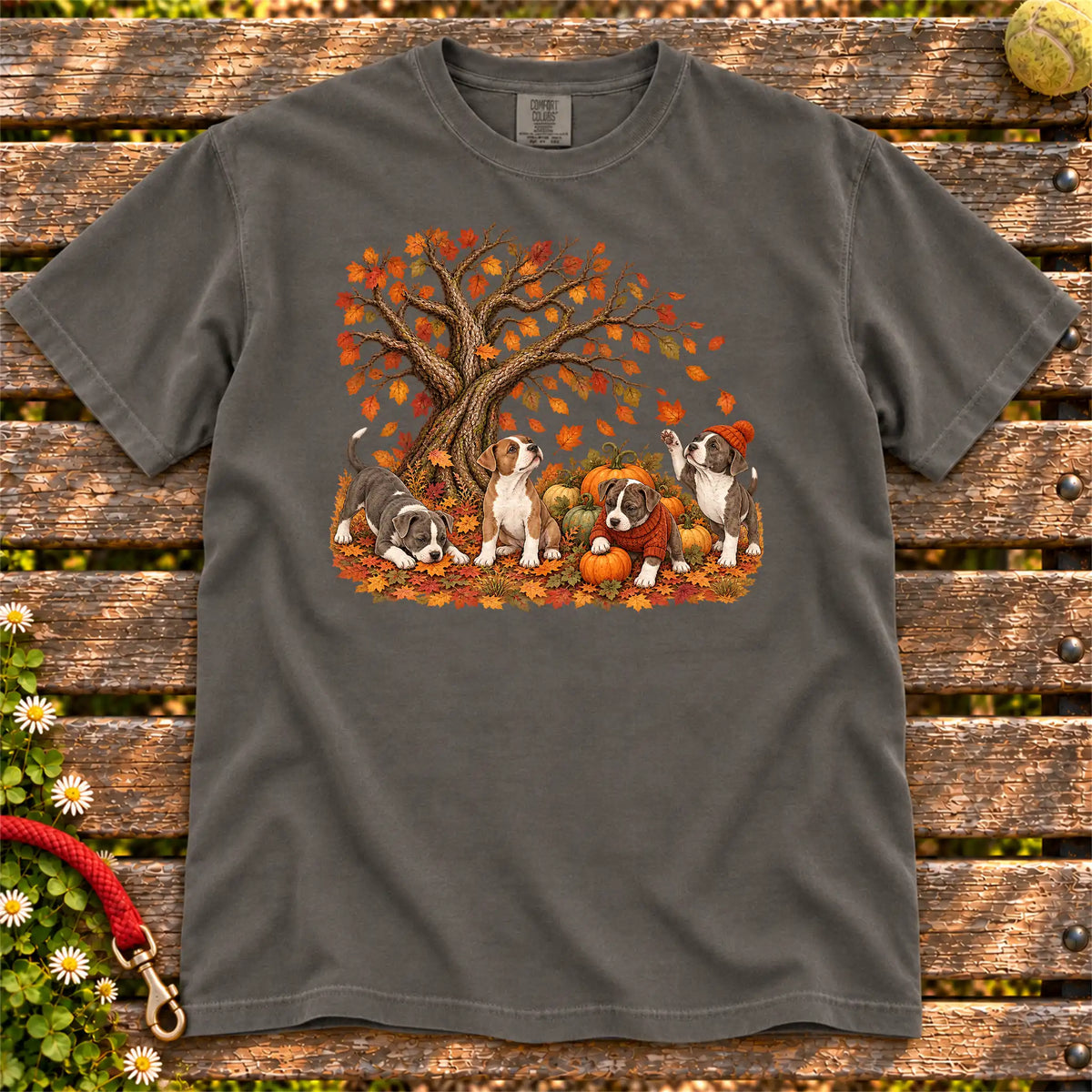 Four Pitbull puppies with pumpkins beneath an autumn tree on a Pepper garment-dyed T-shirt