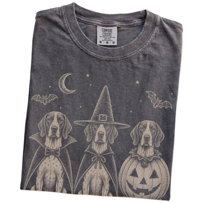 Folded Pepper Comfort Colors® T-shirt showing three Pointer dogs dressed for Halloween beneath bats and a crescent moon