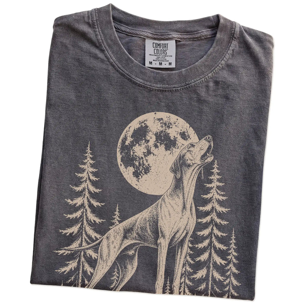 Folded Pepper Comfort Colors® T-shirt showing a Pointer howling beneath the moon and pine trees