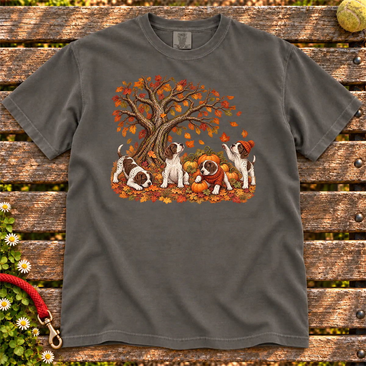 Four Pointer puppies with pumpkins beneath an autumn tree on a Pepper garment-dyed T-shirt