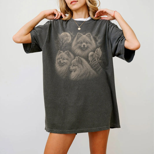 Model wearing a Pepper Comfort Colors® T-shirt with a vintage moon montage featuring Pomeranian