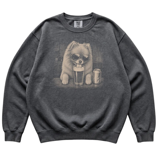 Pepper Pomeranian drinking from a pint at a bar, laid flat