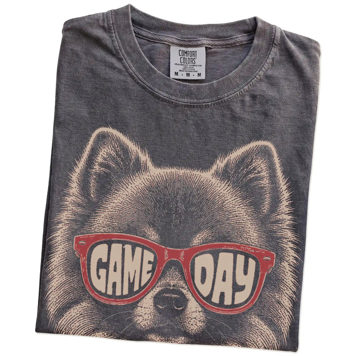 Folded Pepper Comfort Colors® T-shirt showing pomeranian wearing red game day sunglasses