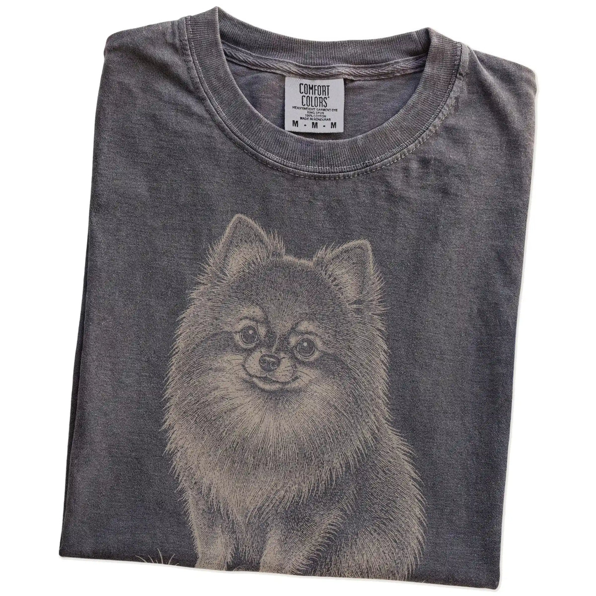 Folded Pepper Pomeranian Karma T-Shirt showing the graphic