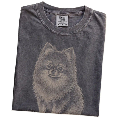Folded Pepper Pomeranian Karma T-Shirt showing the graphic
