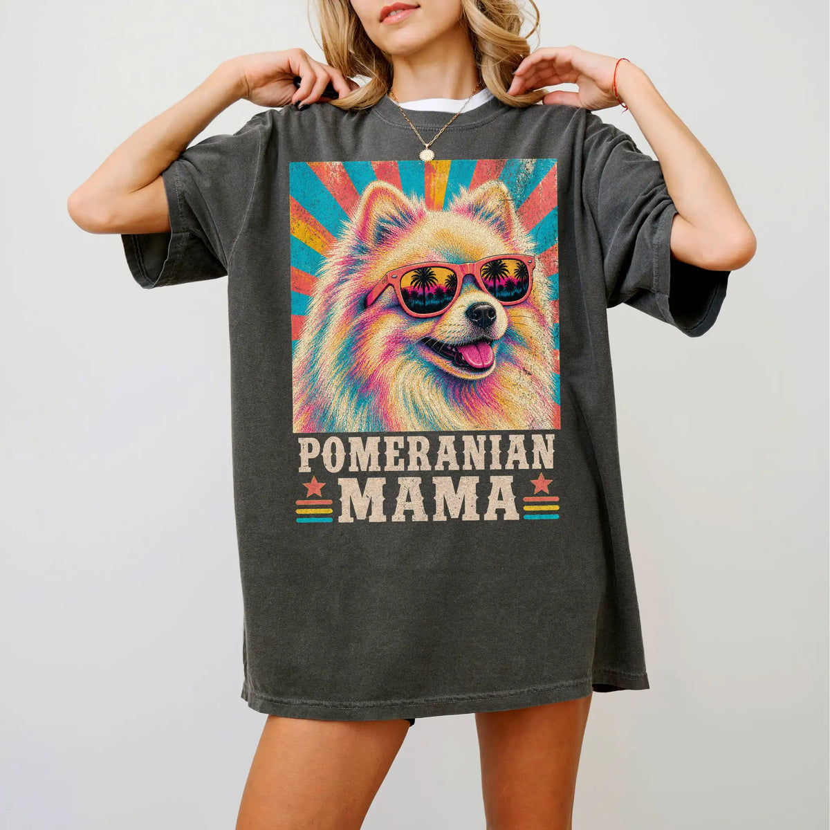 Retro Pomeranian Mama design on a Pepper Comfort Colors T-shirt worn by a model