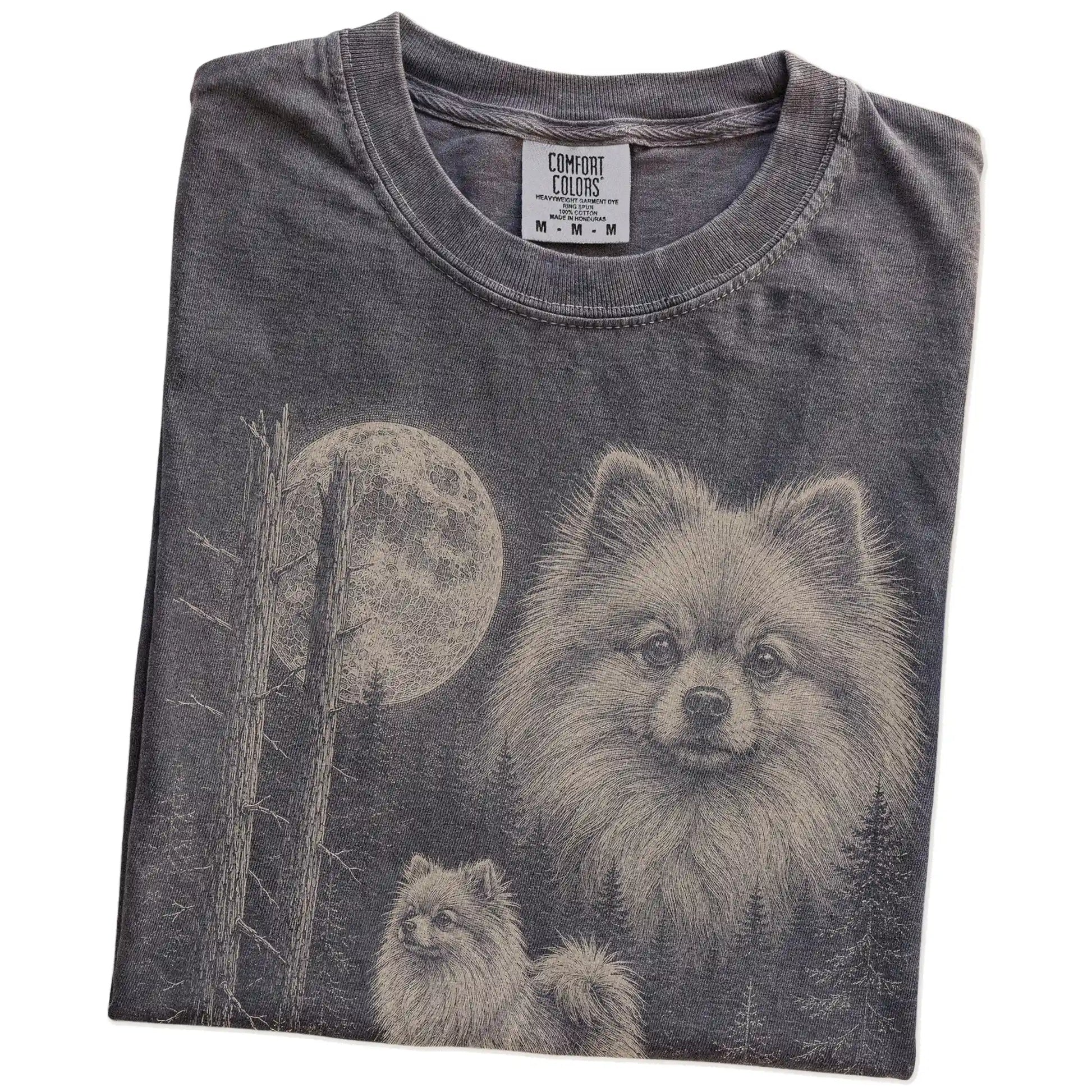 Folded Pepper Pomeranian Moonlit Forest T-Shirt showing the graphic