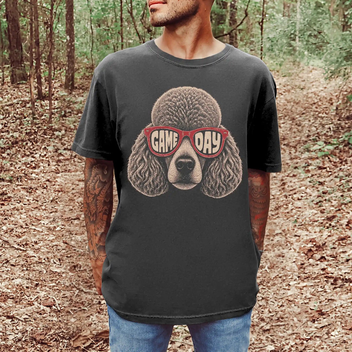 Model wearing a Pepper Comfort Colors® T-shirt with poodle wearing red game day sunglasses
