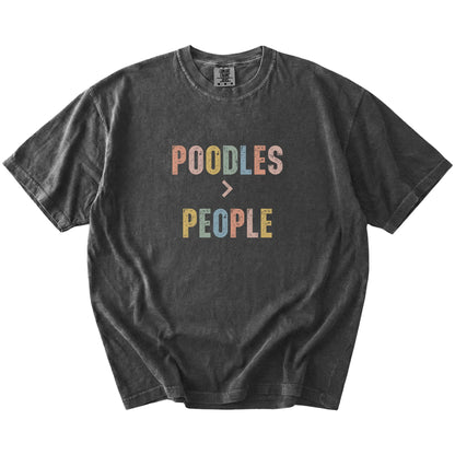 “Poodles > People” text on a Pepper Comfort Colors® T-shirt
