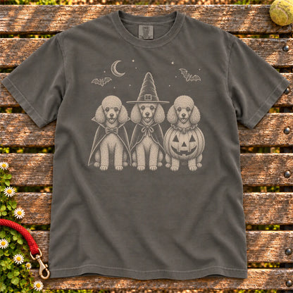 Three Poodle dogs dressed for Halloween beneath bats and a crescent moon on a Pepper Comfort Colors® T-shirt