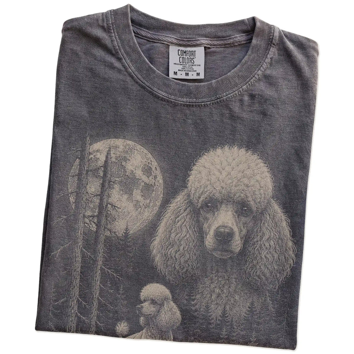 Folded Pepper Poodle Moonlit Forest T-Shirt showing the graphic