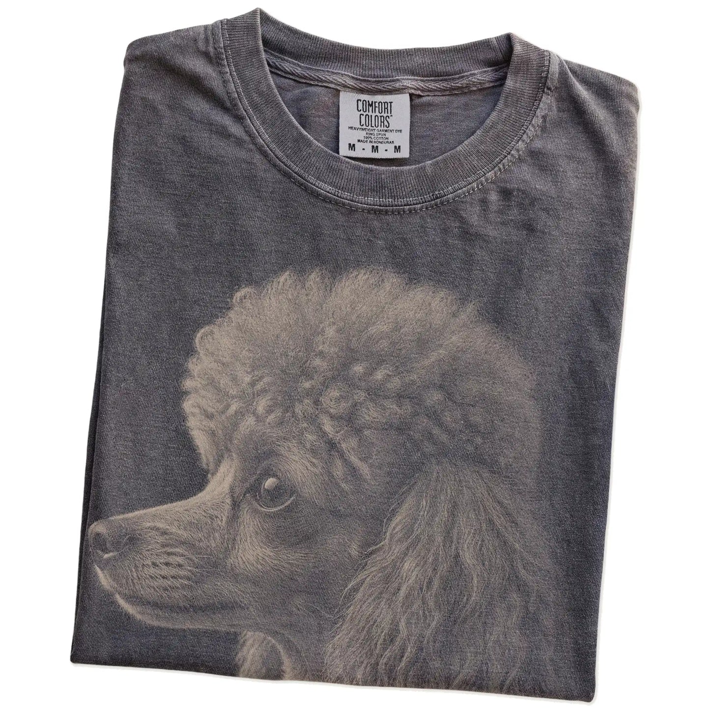 Folded Pepper Comfort Colors® T-shirt showing a detailed photographic portrait of a Poodle