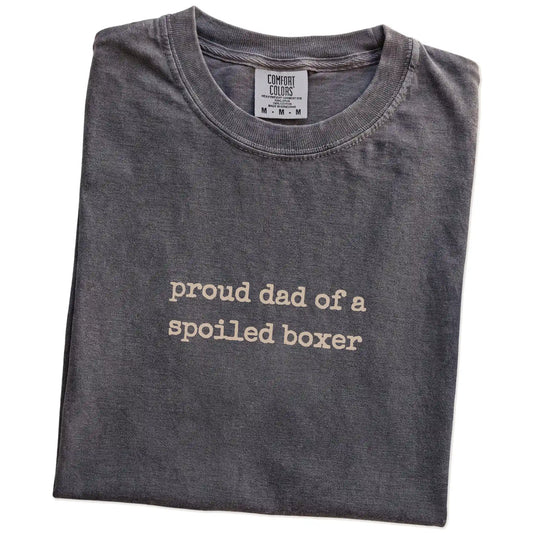 Folded Pepper Comfort Colors® T-shirt showing proud dad of a spoiled boxer lettering