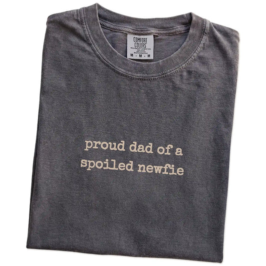 Folded Pepper Comfort Colors® T-shirt showing proud dad of a spoiled newfie lettering