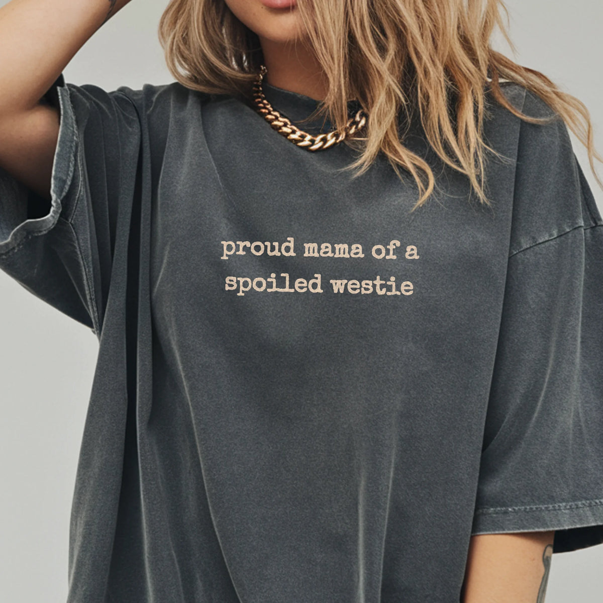 Woman wearing a Pepper Proud Mama of a Spoiled Westie shirt