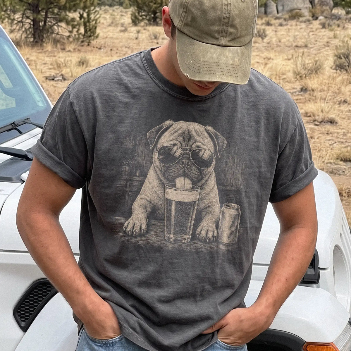 Model wearing a Pepper Comfort Colors® t-shirt with Pug sneaking a drink from a pint