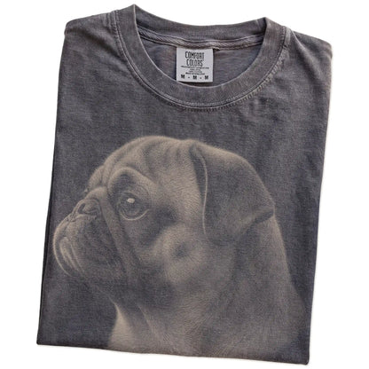 Folded Pepper Comfort Colors® T-shirt showing a detailed photographic portrait of a Pug