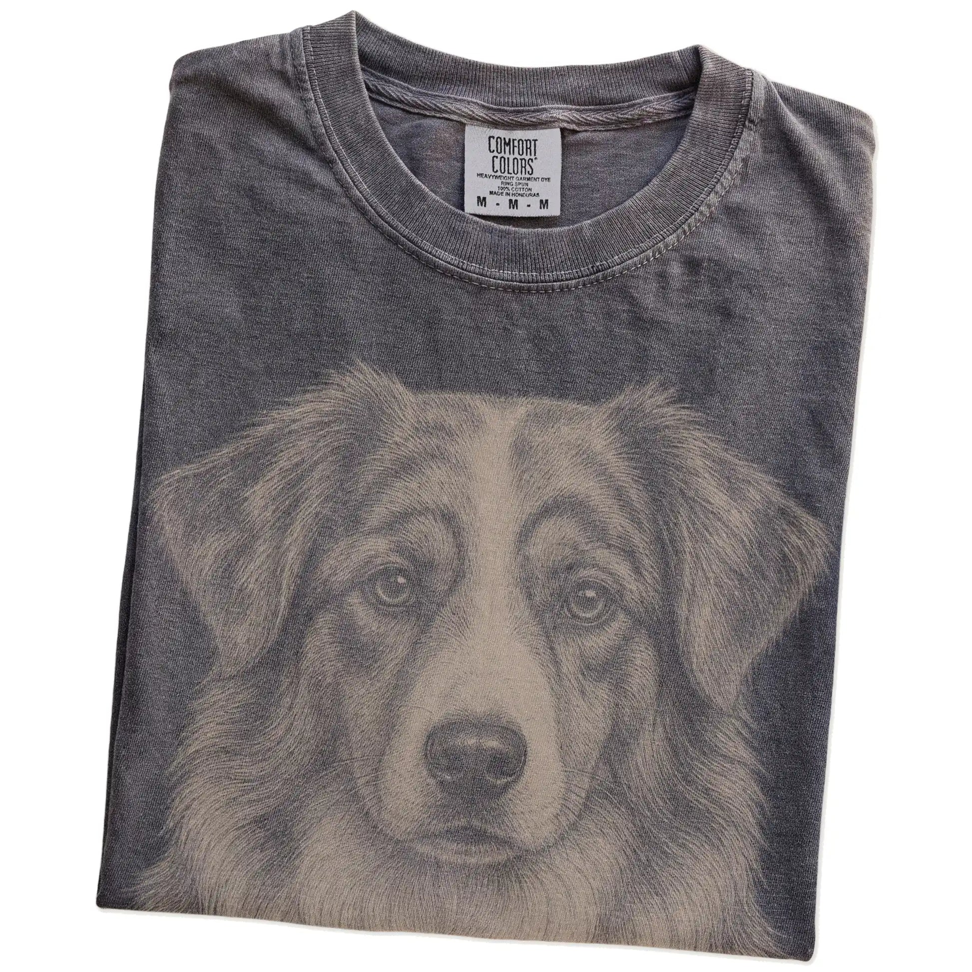 Folded Pepper Comfort Colors® T-shirt showing a realistic drawing of a Australian Shepherd