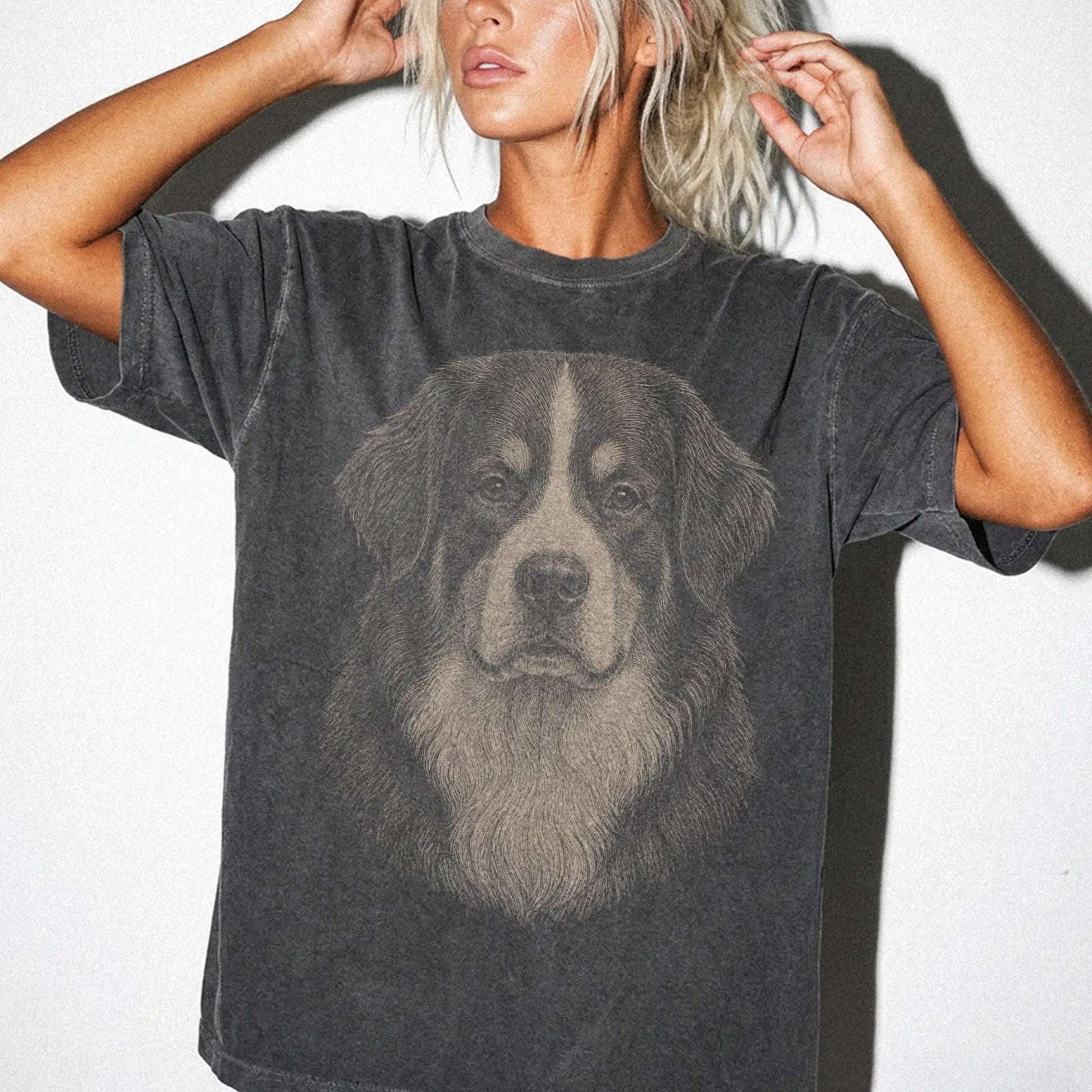 Model wearing a Pepper Comfort Colors® T-shirt with a realistic drawing of a Bernese Mountain Dog