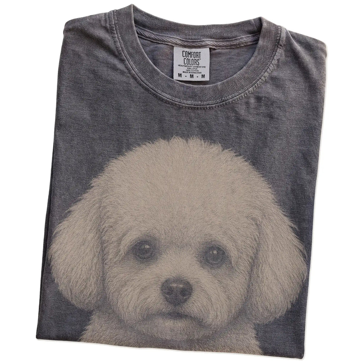 Folded Pepper Comfort Colors® T-shirt showing a realistic drawing of a Bichon Frise