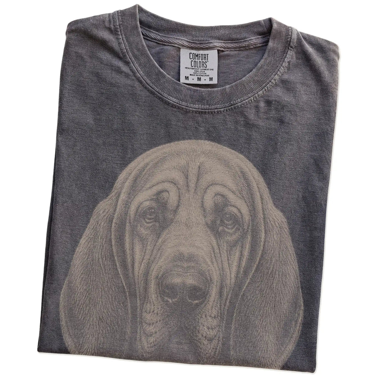 Folded Pepper Comfort Colors® T-shirt showing a realistic drawing of a Bloodhound