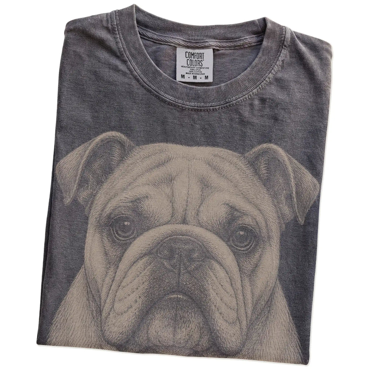 Folded Pepper Comfort Colors® T-shirt showing a realistic drawing of a Bulldog