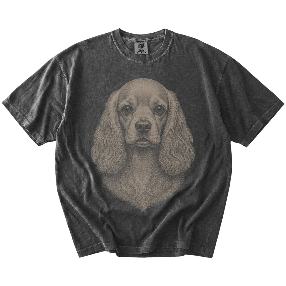 A realistic drawing of a Cocker Spaniel on a Pepper Comfort Colors® T-shirt