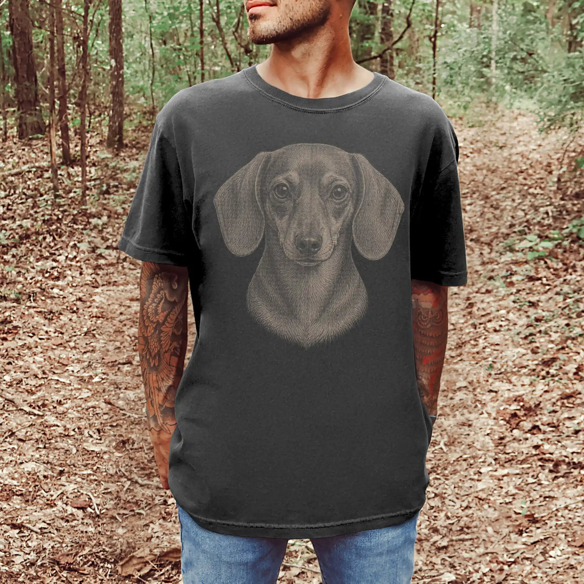Model wearing a Pepper Comfort Colors® T-shirt with a realistic drawing of a Dachshund