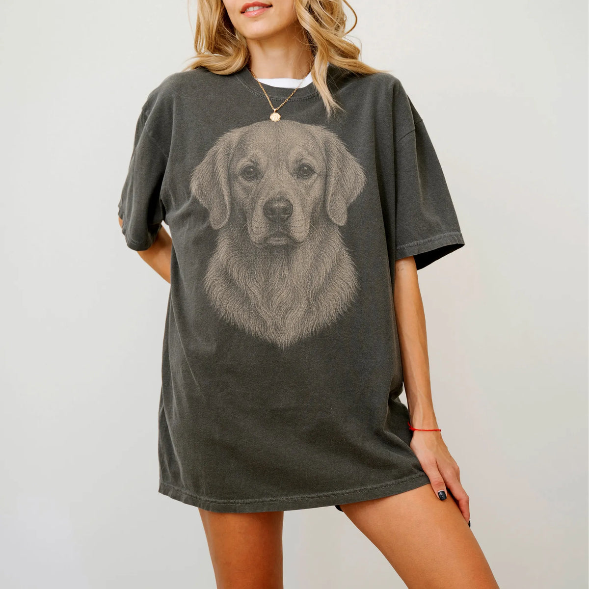 Model wearing a Pepper Comfort Colors® T-shirt with a realistic drawing of a Golden Retriever