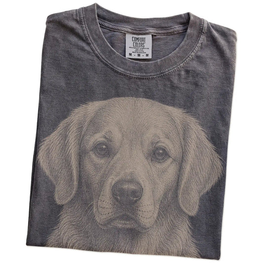 Folded Pepper Comfort Colors® T-shirt showing a realistic drawing of a Golden Retriever