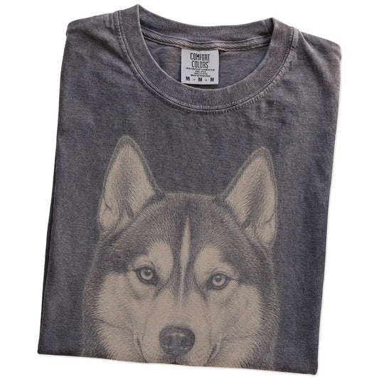 Folded Pepper Comfort Colors® T-shirt showing a realistic drawing of a Husky