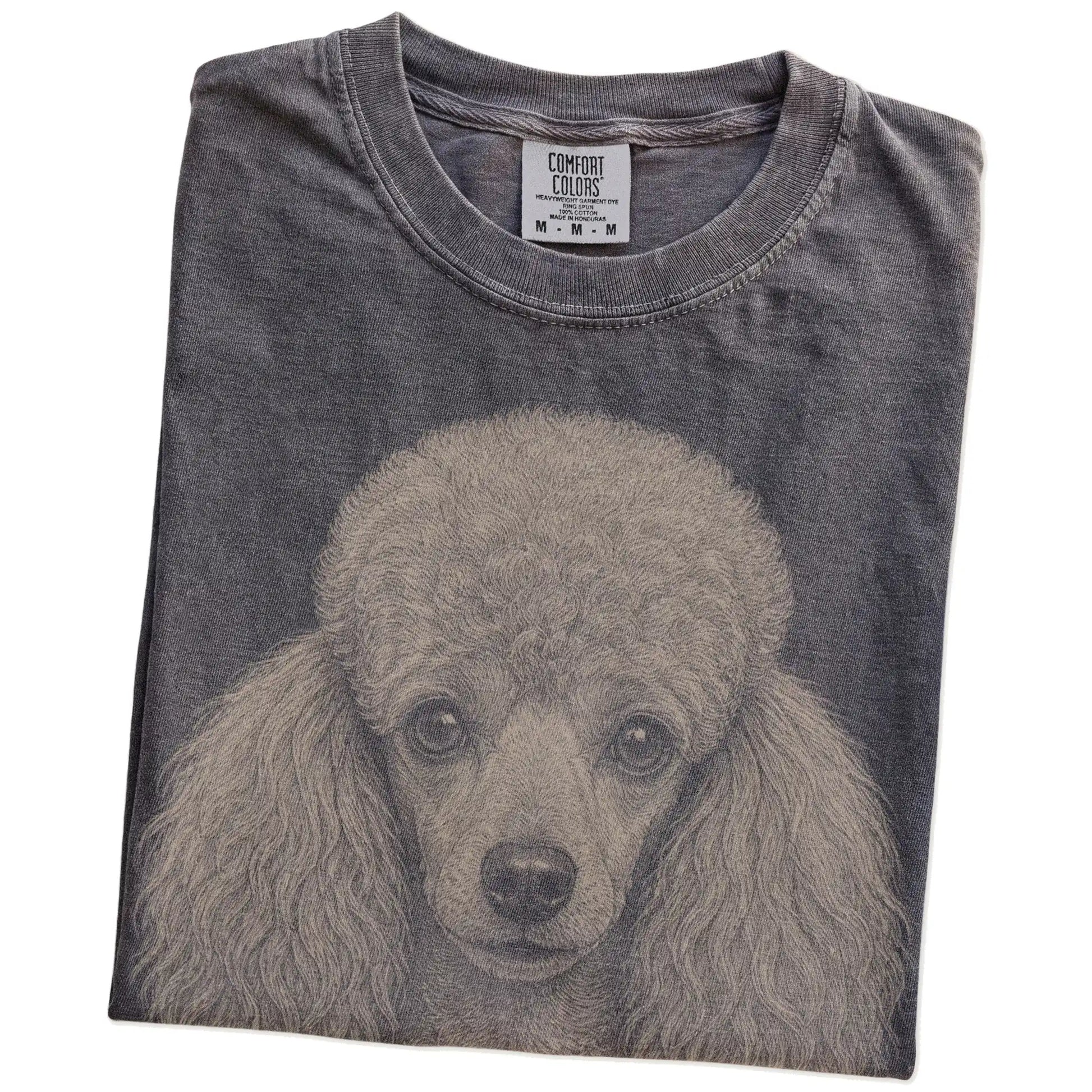 Folded Pepper Comfort Colors® T-shirt showing a realistic drawing of a Poodle