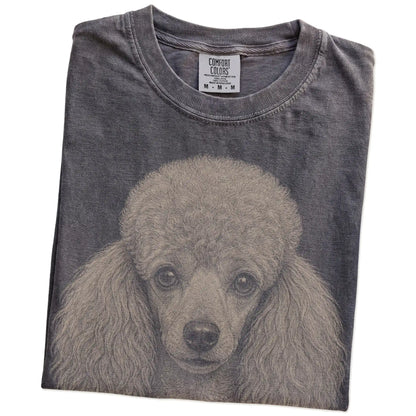 Folded Pepper Comfort Colors® T-shirt showing a realistic drawing of a Poodle