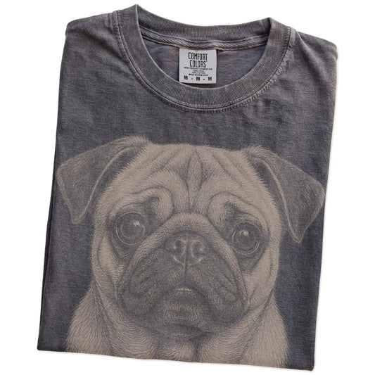Folded Pepper Comfort Colors® T-shirt showing a realistic drawing of a Pug