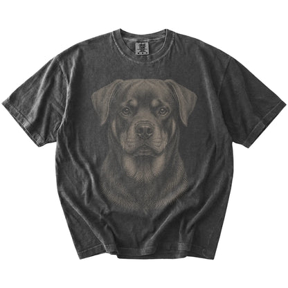 A realistic drawing of a Rottweiler on a Pepper Comfort Colors® T-shirt