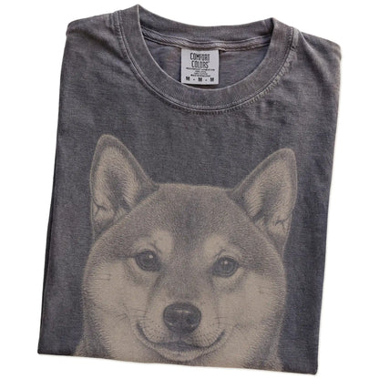 Folded Pepper Comfort Colors® T-shirt showing a realistic drawing of a Shiba Inu