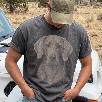Model wearing a Pepper Comfort Colors® T-shirt with a realistic drawing of a Weimaraner