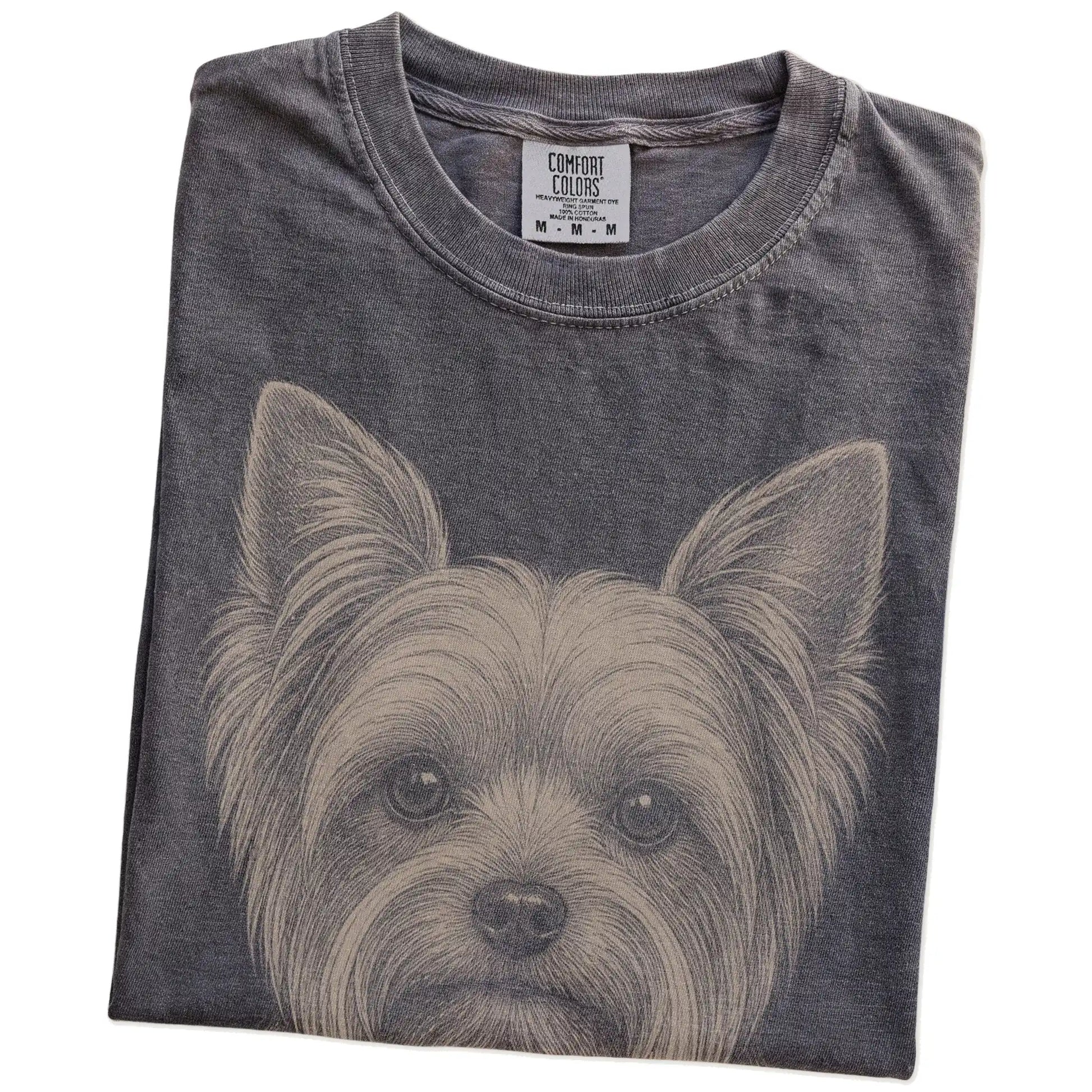 Folded Pepper Comfort Colors® T-shirt showing a realistic drawing of a Yorkie
