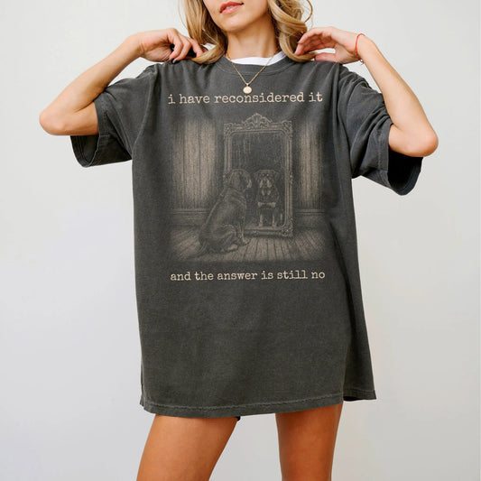Model wearing a Pepper Comfort Colors® T-shirt with “the answer is still no” rottweiler design