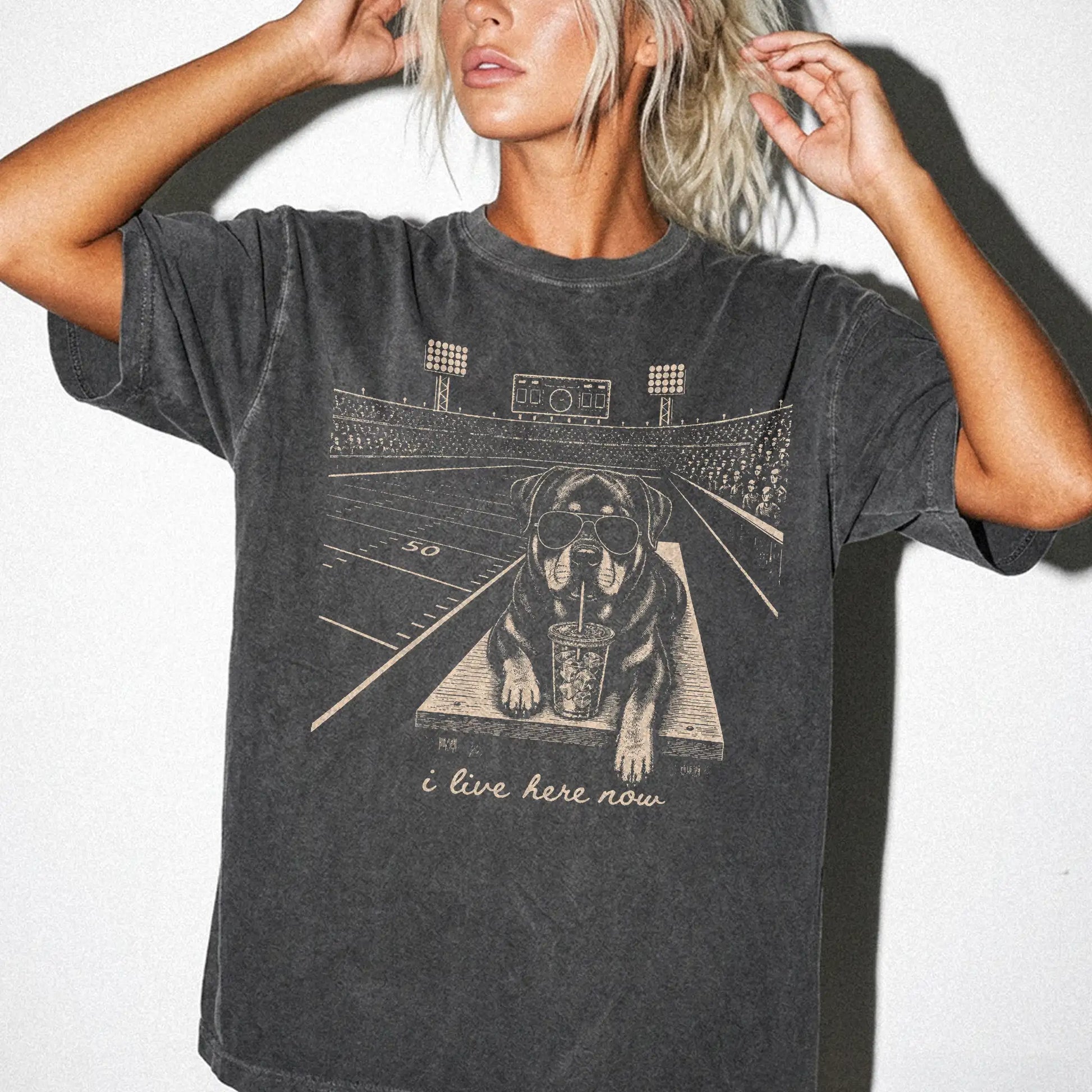 Model wearing a Pepper Comfort Colors® T-shirt featuring Rottweiler ready for football and tailgate season