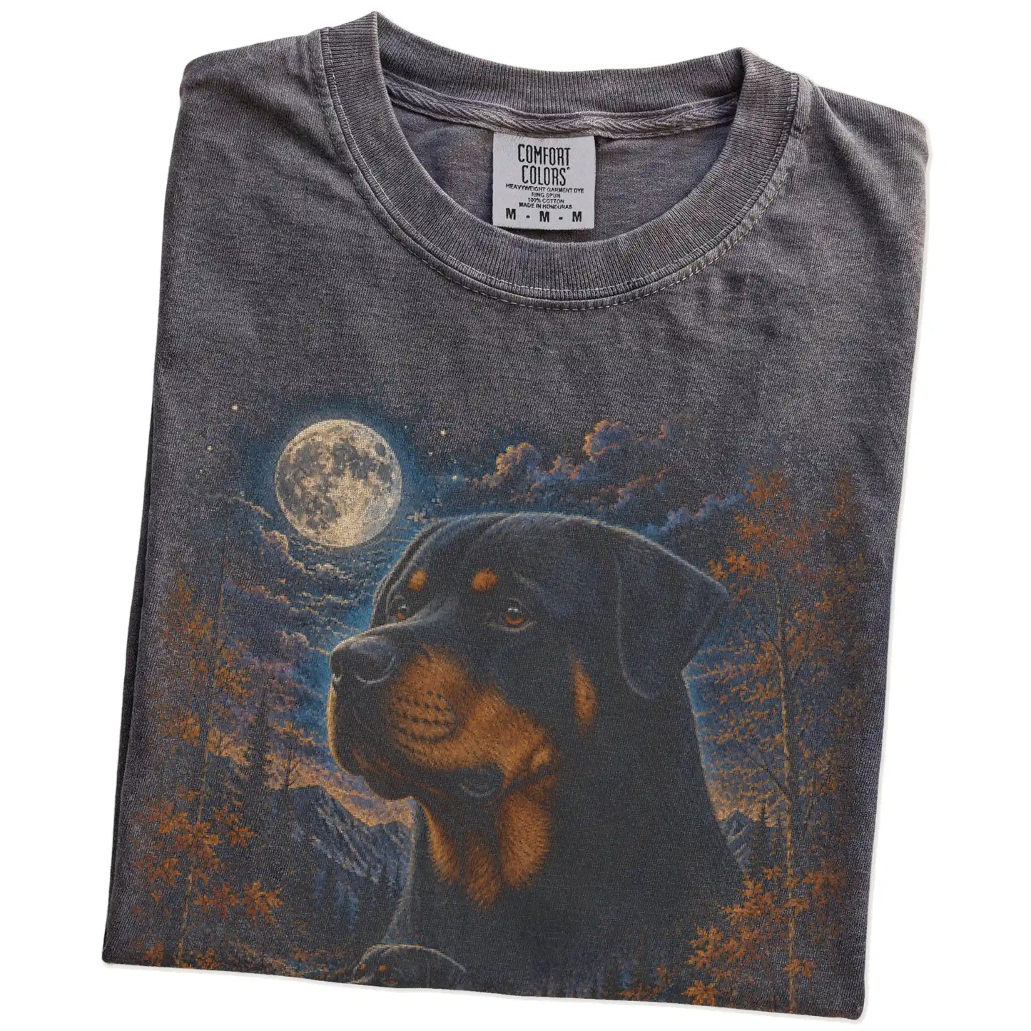 Folded Pepper Comfort Colors® t-shirt showing Rottweiler in a fall forest graphic