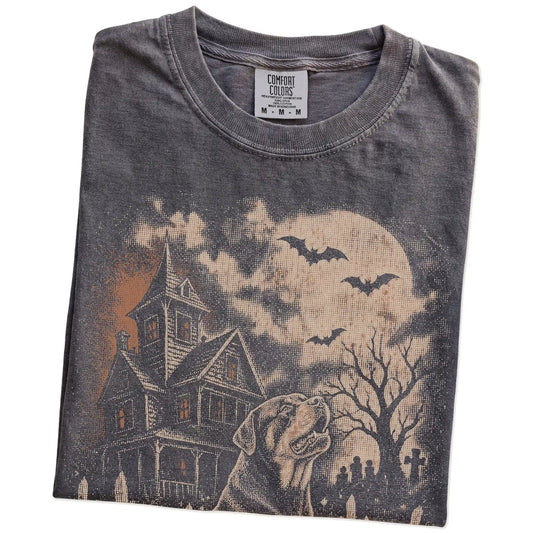 Folded Pepper Comfort Colors® T-shirt showing Rottweiler in a vintage haunted-house scene