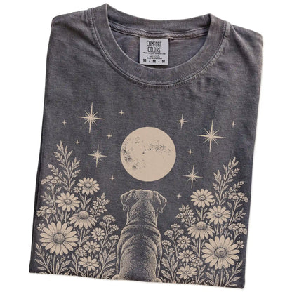 Folded Pepper Comfort Colors® T-shirt showing Rottweiler beneath a wildflower moon
