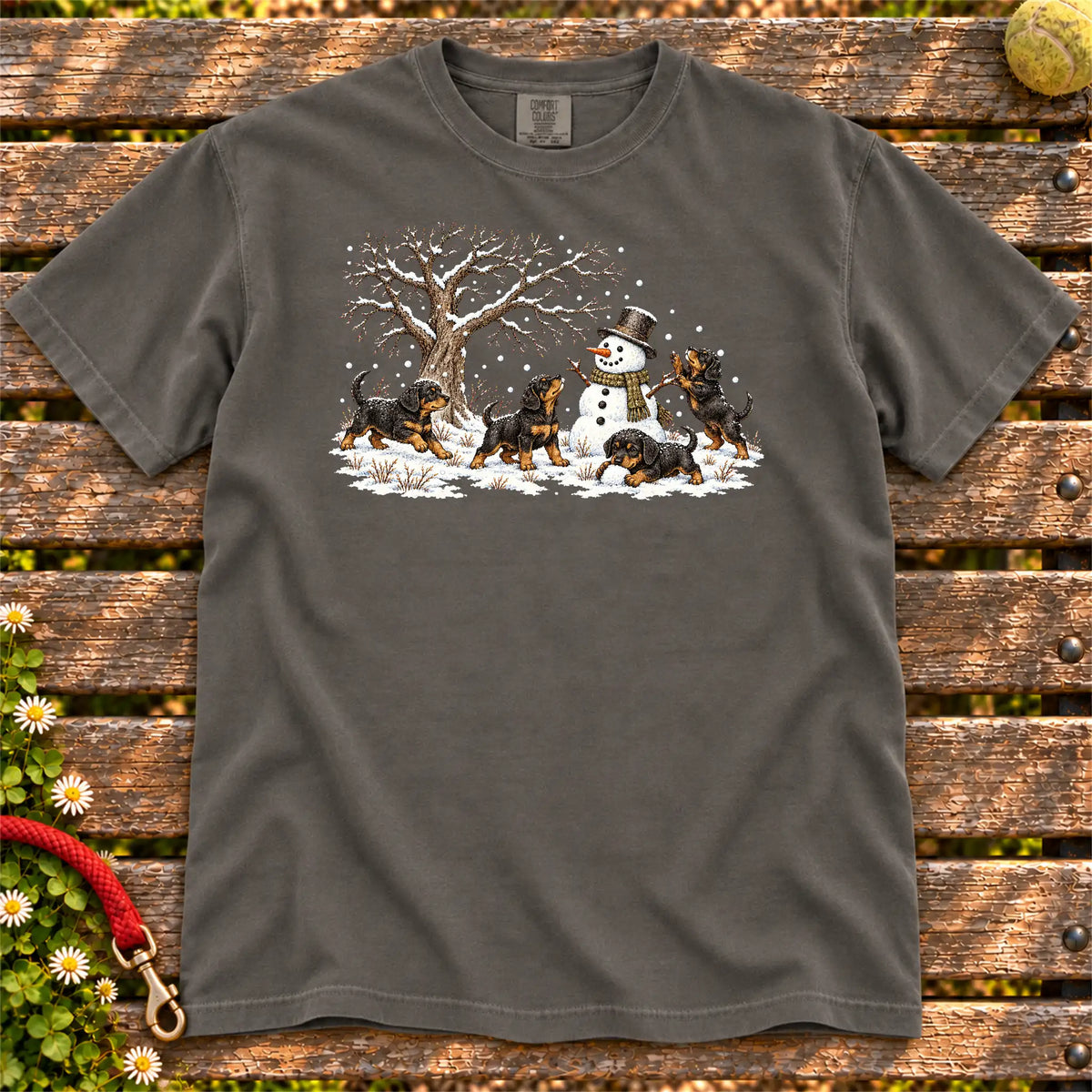 Rottweiler puppies playing in snow with a snowman on a Pepper T-shirt