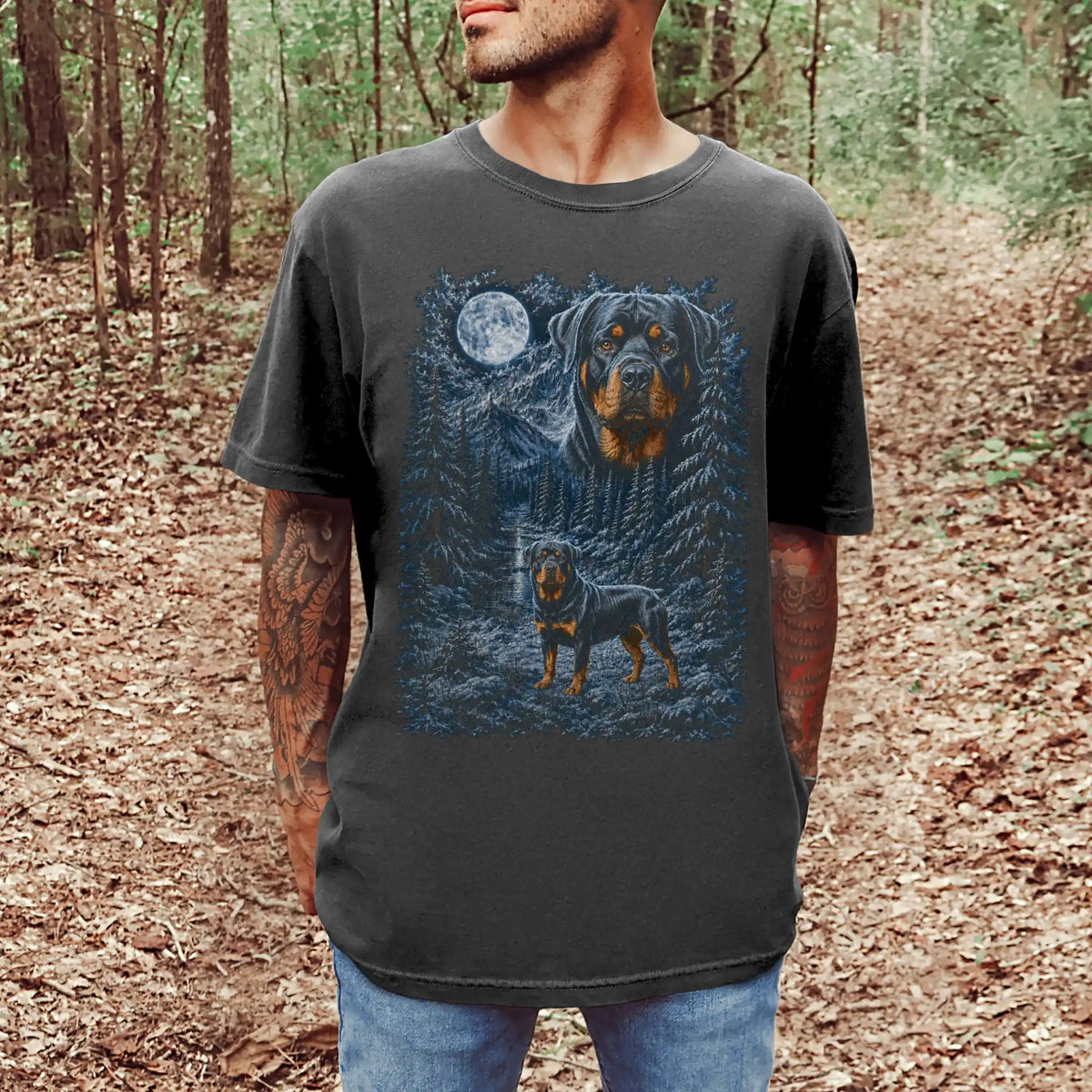 Model wearing a pepper T-shirt with Rottweiler Winter Moon artwork.