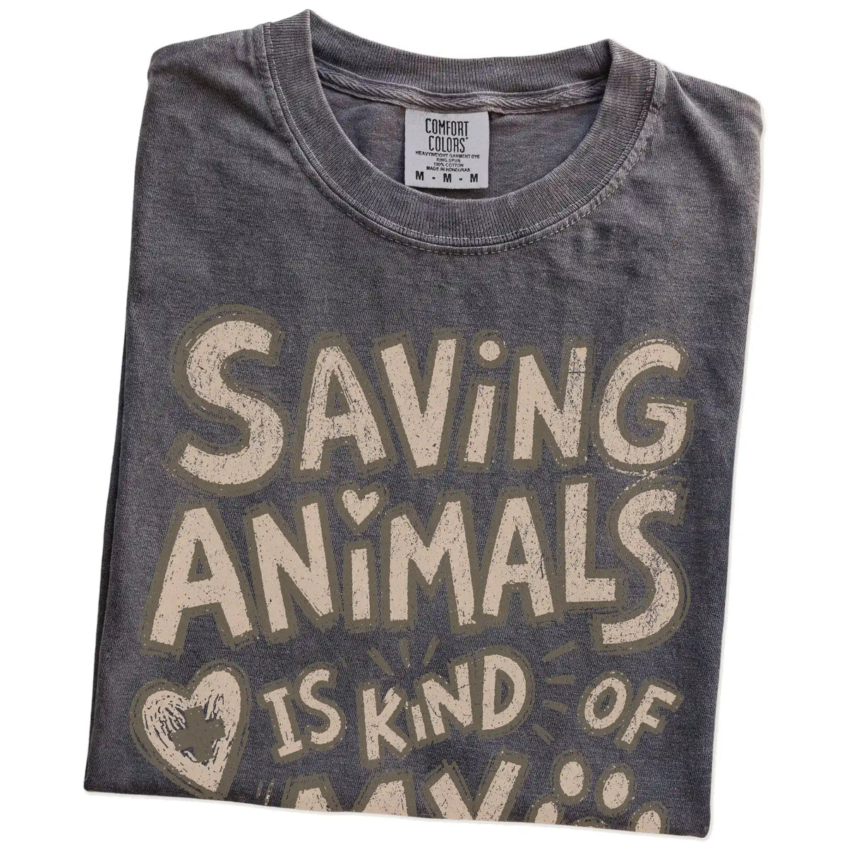 Folded Pepper Comfort Colors® T-shirt showing saving animals is kind of my thing lettering