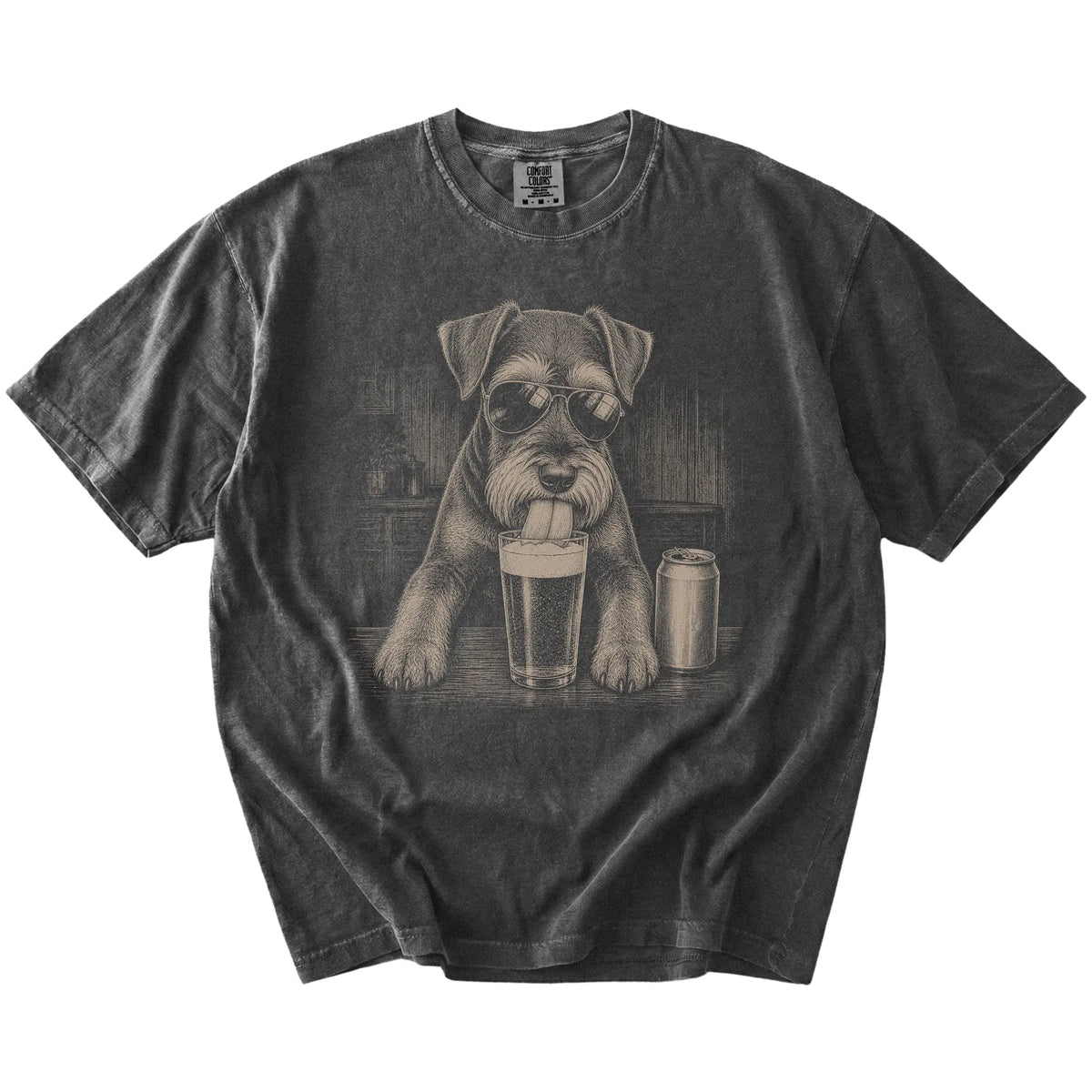 Schnauzer sneaking a drink from a foamy pint at home on a Pepper Comfort Colors® t-shirt