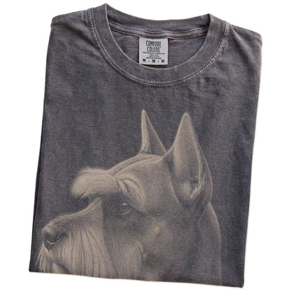 Folded Pepper Comfort Colors® T-shirt showing a detailed photographic portrait of a Schnauzer