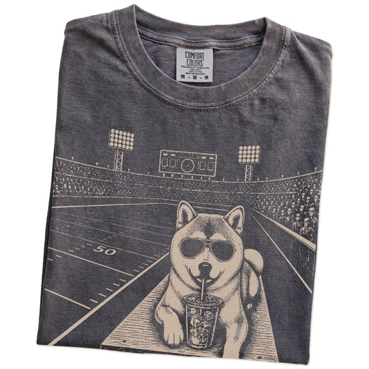 Folded Pepper Comfort Colors® T-shirt showing Shiba Inu ready for football and tailgate season